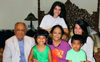 With wife and grandchildren